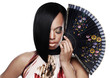 Closeup of a model with a very stylish haircut holding a fan