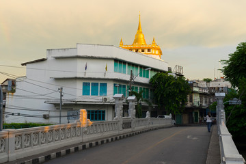 Wall Mural - The golden mount in Wat Sraket Rajavaravihara temple at sunset light in Bangkok, Thailand