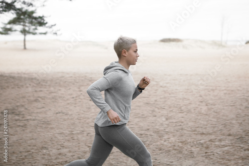 Side View Picture Of Beautiful Athletic Young Caucasian Woman With