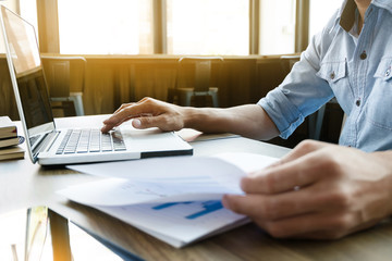 Business calculate data chart documents on the desk at the office