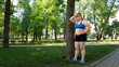 © motortion - Fat young women resting after hard training in park, struggling with obesity