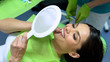 © motortion - Attractive lady looking at result of sealant placement, cosmetic dentistry