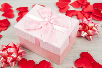 Wall Mural - pink gift box with textile heart shapes