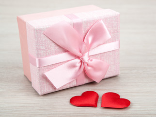 Wall Mural - pink gift box with two textile heart shapes