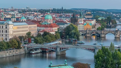 Wall Mural - Aerial evening view of the Vltava River and illuminated bridges day to night timelapse, Prague