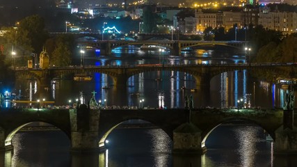 Wall Mural - Aerial night view of the Vltava River and illuminated bridges timelapse, Prague