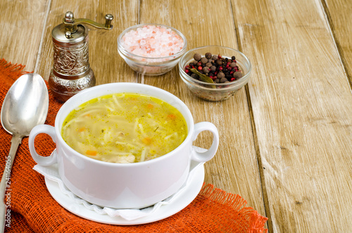 Cuadros en Lienzo Chicken broth vermicelli on wooden table, dinne