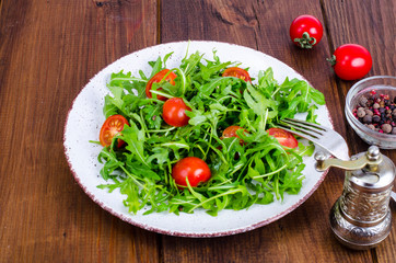 Poster - Plate with light dietary salad of arugula and cherry tomatoes