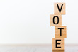 © raquel - Vote written on wooden cubes