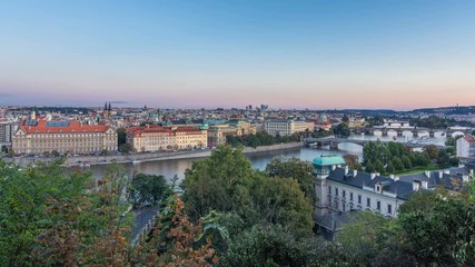 Wall Mural - Evening Panorama of Prague with Vltava river and Prague Bridges day to night timelapse.