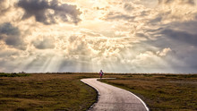 Inspirational Image Of Person Walking Along Path With Sun Rays. Suitable For Background Use Or Adding Text
