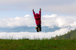 © AungMyo - happy child jumping playing on mountain at morning time