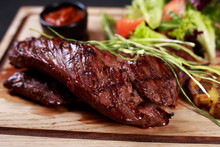 Juicy Medium Rare Skirt Steak, Hanging Tender Steak Served With Vegetable Salad And Potatoes On Board, Traditional American Cuisine,grill And Barbeque, Meat Restaurant Menu