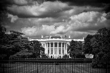 Dark And Foreboding Monochrome View Of The White House With Storm Clouds Brewing Above The South Lawn In Washington DC, USA