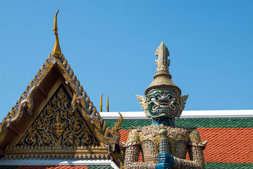 Wall Mural - the giant in Temple of the Emerald Buddha (Wat pha kaew) with blue sky.