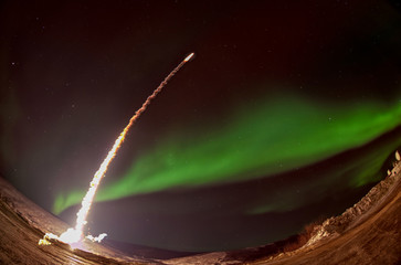 Wall Mural - missile launch at night with aurora polaris. fish eye lens. the elements of this image furnished by 