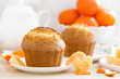 © Sea Wave - Muffin with tangerines closeup on white background. Sweet delicious homemade baking. . White background. Wooden background.