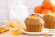 © Sea Wave - Muffin with tangerines closeup on white background. Sweet delicious homemade baking. . White background. Wooden background.