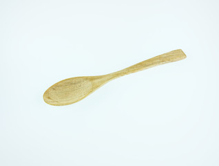 Wall Mural - Wooden spoon on white background,