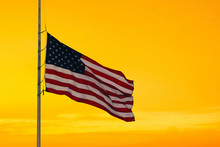 American Flag On The Sunset Sky Background