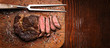 tasty and fresh, very juicy ribbey steak of marbled beef, on a wooden table.