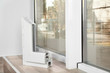 Sample of modern window profile on sill indoors, space for text. Installation service