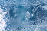 Fototapeta Tęcza - The texture of the ice. The frozen water.Winter background  
