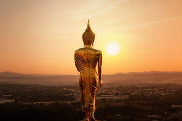 Wall Mural - Golden Buddha Statue in the Morning,Nan province,Thailand