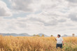 © ณัฐวุฒิ เงินสันเทียะ - The girl is traveling in the grass field desho grass