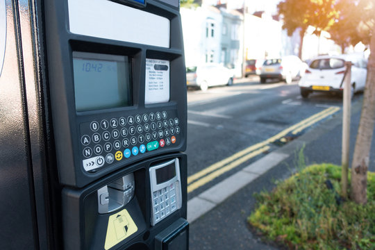 Wall Mural - Self service car parking machine. Electronic car parking machine ticket payment in the city streets at Brighton city town, UK.