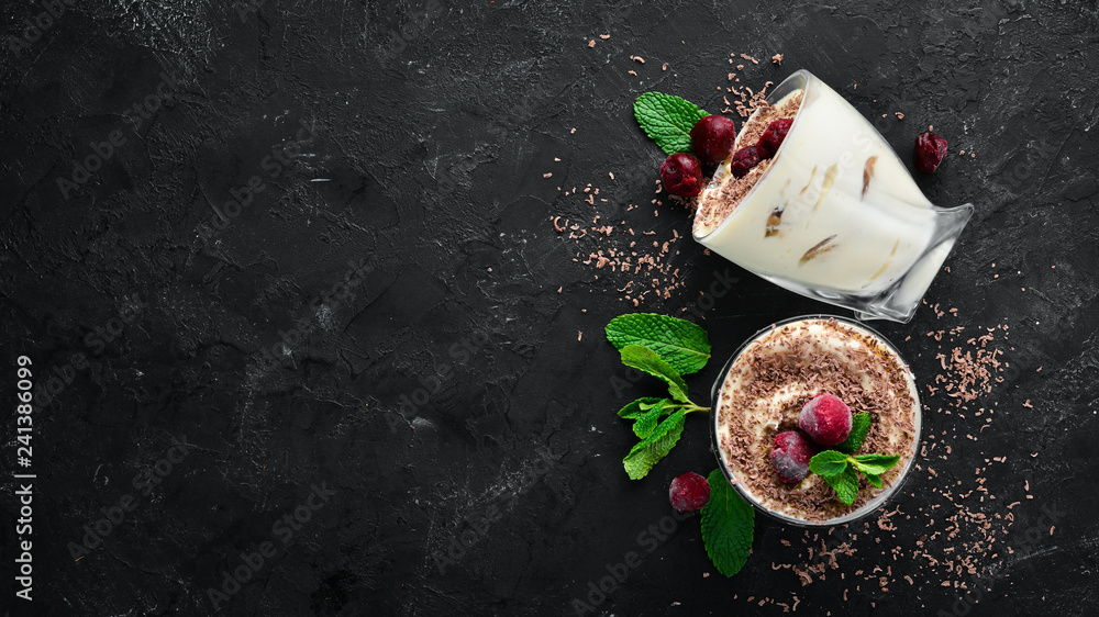 Dessert Tiramisu with cherries. Top view. Free space for your text. - obrazy, fototapety, plakaty 