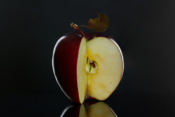 Wall Mural - Cut red juicy apple close up