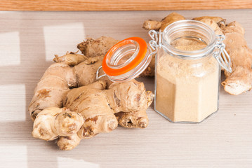 Wall Mural - ginger root on the wooden background