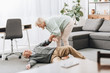 © LIGHTFIELD STUDIOS - old woman helping to husband who falled down on floor
