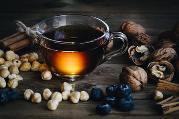 Wall Mural - still life of Cup of tea with dried fruit and cinnamon, vintage style