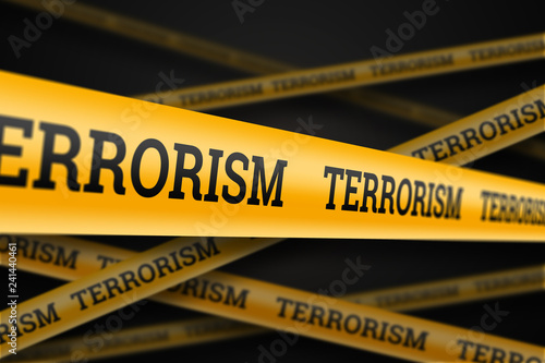 Fotomural Inscription terrorism on a yellow barrage on a black background