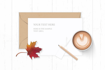 Wall Mural - Flat lay top view elegant white composition letter kraft paper envelope pencil tag autumn maple leaf and coffee on wooden background