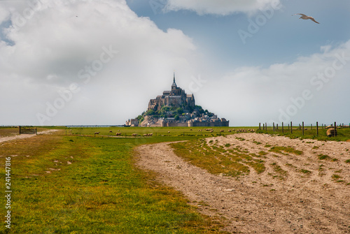 Fotografie, Obraz Le Mont Saint Michelewith blue sky and clouds, Normandy, northern France