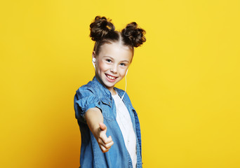 Wall Mural - Portrait of a beautiful and confident girl showing thumbs up 