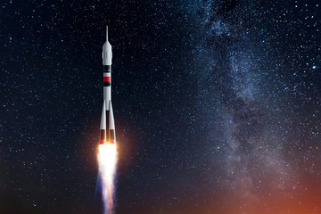Wall Mural - rocket against the starry sky. the concept of space exploration, satellite launch, flight to the moo