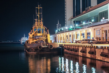 night view of the tugboat in the cargo port of Odessa