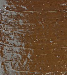 Wall Mural - Cake with chocolate and caramel cream layers. Isolated on white background. Section of multilayer chocolate cake with chocolate glaze. 