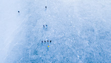 Aerial View Of Frozen Lake. Many Ice Skaters On The Ice. Winter Background Concept. Dam Ceske Udoli Near Pilsen, Czech Republic, European Union.