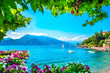 Varenna town bay beach and flowers, Como Lake district landscape. Italy, Europe.