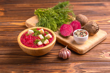 Wall Mural - Bright tasty pureed beetroot soup with ingredients. Healthy food