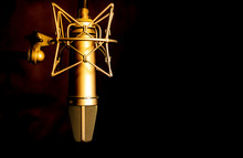 Golden Color Microphone Detail In Music And Sound Recording Studio, Black Background, Closeup