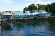 © Michael O'Keene - Expensive center console fishing boats on boat lifts at a marina dock