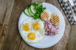 Fried eggs with cabbage and toast