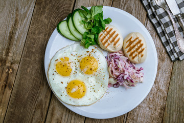 Wall Mural - Fried eggs with cabbage and toast