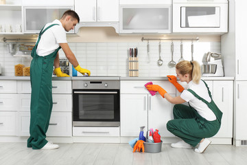 Wall Mural - Team of janitors cleaning kitchen in house